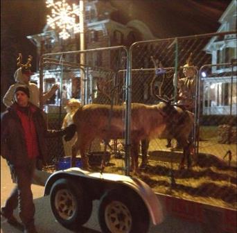 Dr. Joe Martins, DVM, walks along with Reindeer Float.