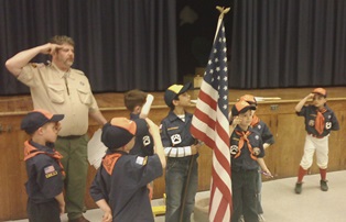 Cub Scouts saluting the flag