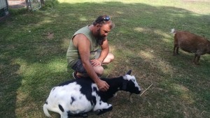 Mark Sopko, BMAH Vet Technician with Goat at Triple C Ranch