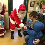 Santa gives out goodies